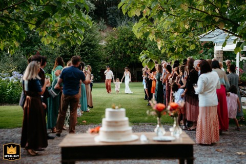Love and Laughter: A Penafiel Family Meeting Their Wedding Cake Together A wedding photojournalist captures a bride and groom in Penafiel, Portugal, as they meet their wedding cake with their daughter.