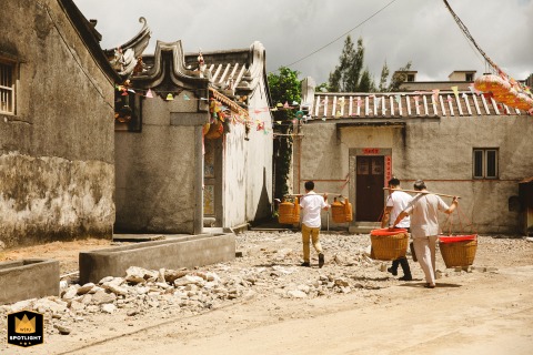 Huilai, China — A wedding photojournalist captures a powerful moment of tradition as newlyweds kneel to kowtow at an ancestral hall, honoring their heritage.