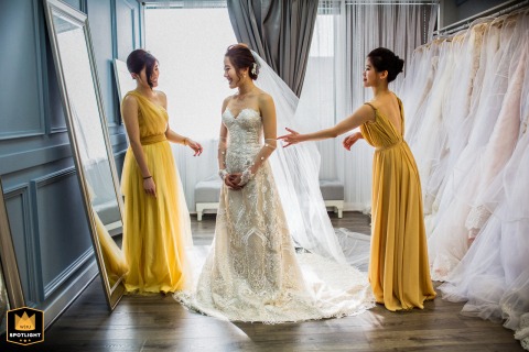 Helping Hands: Bridesmaids in Yellow Assist Bride in a Daly City Salon Bridesmaids in yellow dresses help the bride get ready for her wedding ceremony in a Daly City salon.