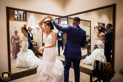Livermore Golden Hour Romance, Mirrored Reflections of a First Dance Couple dancing at their wedding reception with mirror reflections at Garré Vineyard in Livermore, CA.