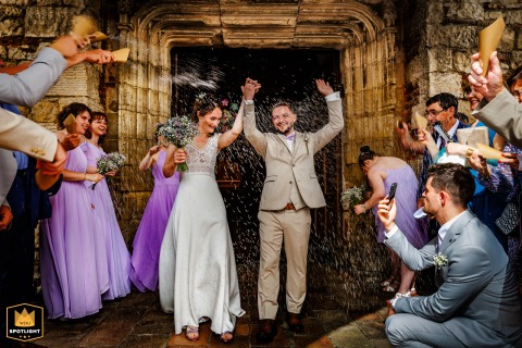 Just-Married: Nègrepelisse's Church Exit Witnesses a New Journey's Start A photo captures a newlywed couple at the church exit in Nègrepelisse, Tarn-et-Garonne, France. The image portrays the joyous first moments of the couple's journey together as husband and wife.