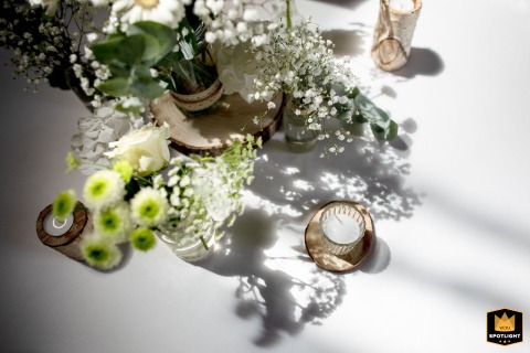 Elegant Wedding Table Decor: Flowers And Candles At Domaine Des Saints Pères France Details of elegant wedding table decorations at Domaine des Saints Pères in France, featuring flowers and candles.