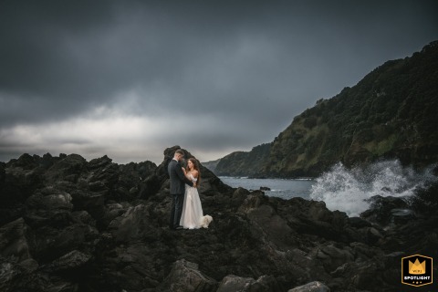 Bride And Groom Exchange Vows On Lava Field Overlooking Ocean In Azores, Portugal Azores, Portugal: Bride and groom exchange vows on a dramatic lava field, surrounded by the vast ocean.