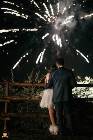 Spouses Watch Fireworks During Cake Cutting At Casa Celincordia, Cesena, Italy Wedding Spouses watch fireworks during cake cutting at Casa Celincordia, Cesena, Italy. A magical wedding moment.