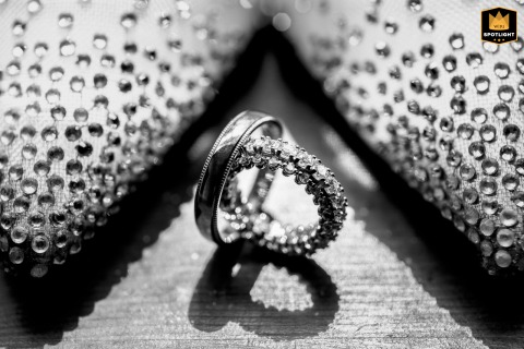 Wedding Bands And Embellished Shoes Paired Elegantly At Château De Fortis, France Wedding bands and embellished shoes sit together at Château de Fortis, France.