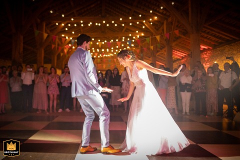 Newlyweds' First Dance Illuminated By Warm, Romantic Light At Domaine De Mariage Opening wedding dance at the Domaine de mariage, with the newlyweds bathed in a warm, romantic light.