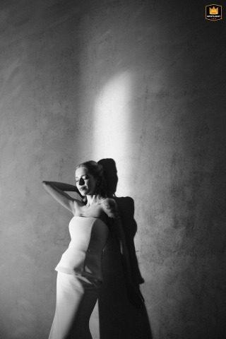 Candid Bridal Portrait Illuminated By Lamplight, Reflected In Mirror By Polish Pool A candid bridal portrait taken at a Polish hotel, with lamplight reflecting off a small mirror by the pool.