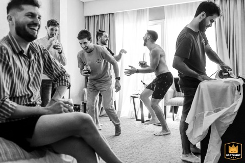 Groom And Friends Preparing For Wedding In Funes, Argentina: Ironing And Fun Groom and friends in Funes, Argentina, getting ready for the wedding: ironing, dressing, and having fun.