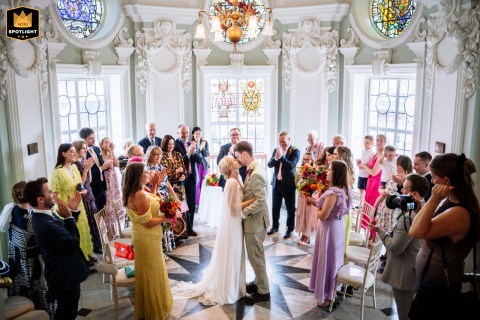 Newlywed Couple’s First Kiss At Lambeth Town Hall Surrounded By Joyous Friends First kiss for a newlywed couple at Lambeth Town Hall, Brixton, surrounded by joyous friends.