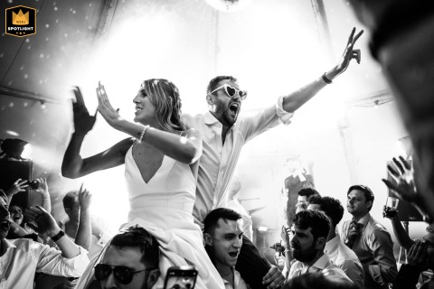 Bride And Groom Dance On Guests’ Shoulders At Twickenham Secret River Garden Wedding Twickenham, Secret River Garden: A joyful bride and groom dance on the shoulders of their wedding guests.