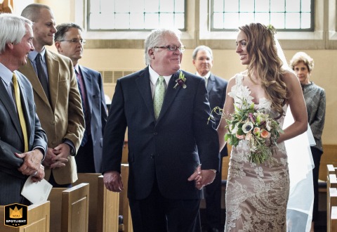 Bride And Father Share Emotional Aisle Walk At Emory Presbyterian Church In Atlanta Bride and her father share a moment walking down the aisle at Emory Presbyterian Church in Atlanta, Georgia.