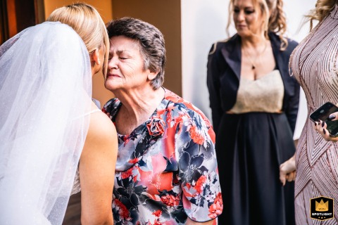 In Plovdiv, a bride shares a tender and loving kiss with her grandmother on her wedding day.