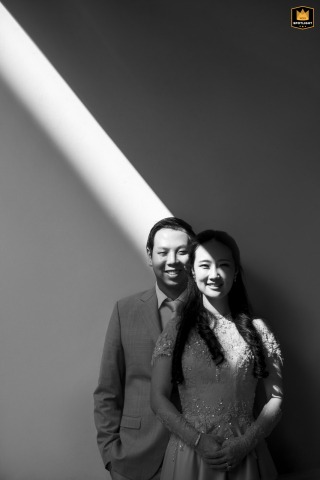 Bangkok Wedding: A Shaft of Light Illuminates The Bride And Groom Black and white wedding portrait in Bangkok, Thailand: a shaft of light illuminates the couple.
