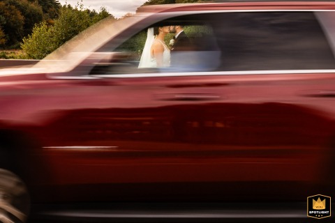 Wharf Kiss Through a Window at The Wharf, Falmouth A kissing couple at The Wharf, Falmouth, Cape Cod, seen through the window of a moving vehicle.