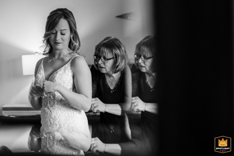 A Mother's Love: Stitching Memories Into a Wedding Gown John River, Kingston, MA: A bride prepares, her mother's steady hands stitching memory into fabric.