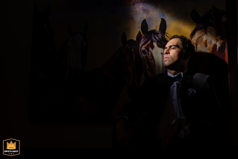 The Groom's Steady Gaze Mirrored by Painted Eyes Brewster, MA: The groom stands in quiet strength, framed by painted eyes that mirror his steadfast grace.