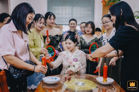 Bride’s Hair Being Combed, a Reflection of a Chinese Wedding Tradition Guests at a wedding in Kaifeng, China, watch a sister comb the bride's hair, reflected in a mirror.