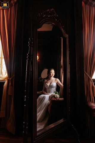 Bridal Reflecting in Window Light, Long Island, New York Elegant bridal portrait: bride's reflection in a mirror, bathed in window light, Long Island, NY.