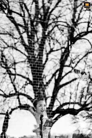 Long Island Bride's Tree and Brick Building Reflection Portrait Portrait of a Long Island bride, with a reflection of a tree and brick building in the window.
