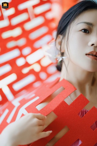 Shades of Happiness: A Bride's Portrait Behind a Classic Symbol The bride, partially hidden by a "double-happiness" symbol in Shanghai.