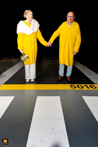 Montauban Underground: A Bride and Groom's First Walk Together Bride and groom hold hands in a Montauban underground parking garage on their wedding day.