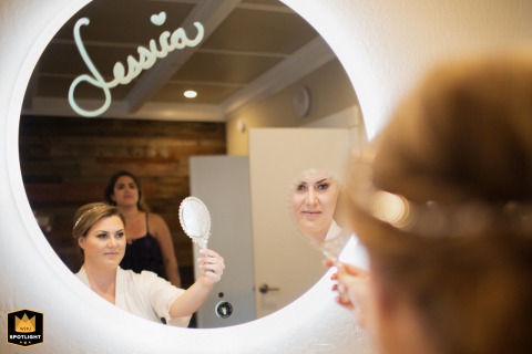 A Bride's Final Serene Moment at Fairfax's Deer Park Villa Bride checks her reflection, a serene moment before the ceremony at Deer Park Villa in Fairfax, CA.