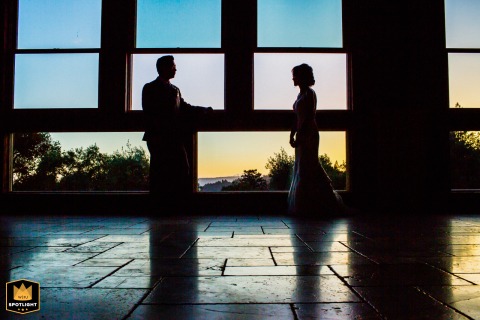California's Sunset: A Silhouetted Wedding Portrait at Regale Winery Sunset wedding portrait at Regale Winery, California, with couple silhouetted against window.