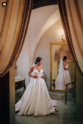 A Moment Of Quiet Reflection In Torre Giulia's Reserved, Luxurious Bridal Suite Torre Giulia reception venue provides a reserved, luxurious suite where the bride is captured enjoying a quiet moment of reflection on her wedding day.