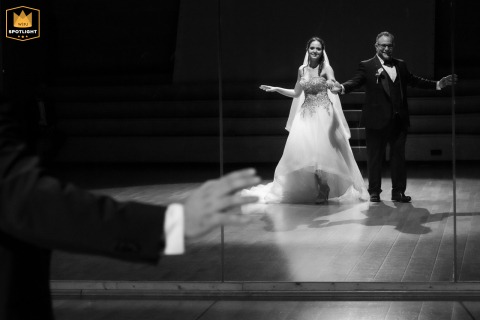 A Dramatic Entrance Where Love Began: Reggio Emilia Dance Studio Wedding Celebration Dance Studio in Reggio Emilia, Italy, is the scene as the newlyweds make a meaningful, dramatic entrance in their formal wedding attire at the place they first met.