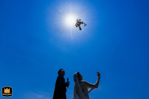 Bride tossing her bouquet on the outdoor lawn during a wedding ceremony in Taiyuan, Shanxi.
