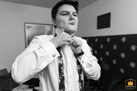 Making Playful Face While Adjusting Tie During Wedding Preparation In Atlanta Lauren making a playful face while adjusting their tie in Atlanta.