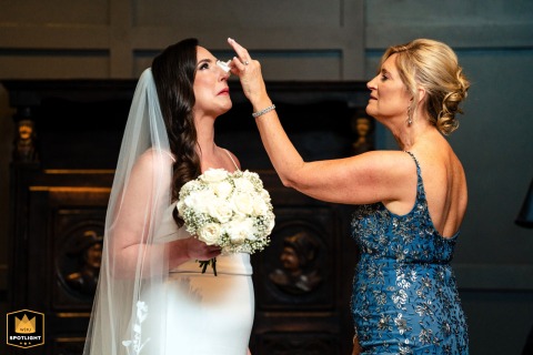 Mother Comforts Bride at The Logan Philadelphia Wedding At The Logan in Philadelphia, a mother uses her steady hand to carefully catch her daughter’s tears, protecting her makeup and calming her overflowing heart.