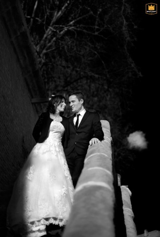 Near the Quai de la Daurade in Toulouse, Haute-Garonne, the newlyweds smile at each other before descending the long stone staircase.