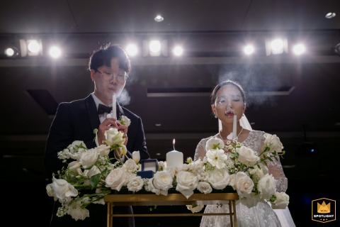 Virginia, KCPC, where the bride and groom after lighting the unity candle, each gently blowing out their individual ceremonial taper candles.