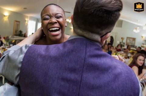 Bride Laughs Joyfully During First Dance At Forrest Hills Reception At Forrest Hills in the North Georgia Mountains, the bride laughs joyfully during the first dance, her happiness radiating as she moves across the dance floor with her partner.
