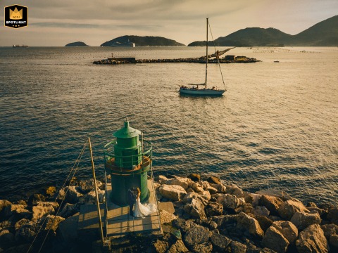   Along the scenic Golfo dei Poeti in La Spezia, Liguria, a portrait session of love blooms at the port, where the couple enjoys the stunning waterside vista together.