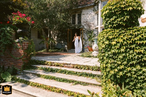   In Cape Elizabeth, Maine, the bride lifts her dress as she approaches the groom blending excitement with a touch of playful elegance.