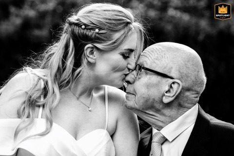   At the reception venue in Zuid Holland, the bride shares a truly special moment with her grandpa, creating a memory filled with warmth and connection across generations.