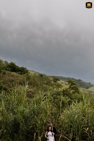 Couple Celebrates Marriage In Rolling Hills Beneath Cloudy Skies In São Paulo, Brazil A couple portrait in nature in São Paulo offers a different perspective on the duo, celebrating their marriage in the hills below the clouds.