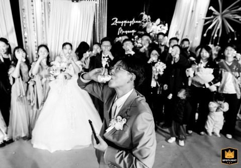 Groom And Friends Toast With Yakult Drinks As The Wedding Concludes In Kaifeng Henan China As the wedding concludes in Kaifeng, China, the groom and friends toast with Yakult drinks, sharing a unique celebratory cheer in place of traditional beverages.