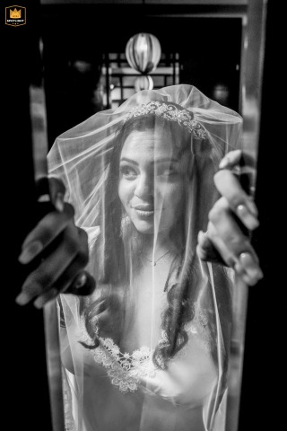 In Avignon, the bride gracefully leaves her room, her expression filled with anticipation as she steps forward to begin her wedding day events.