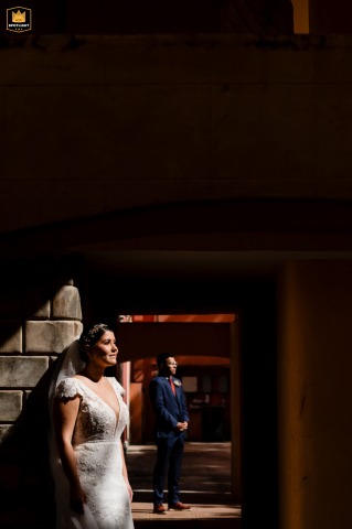 At a colonial hacienda in Mérida, Yucatán, the bride and groom pose together, their attire and the vibrant setting reflecting tradition and contemporary style.
