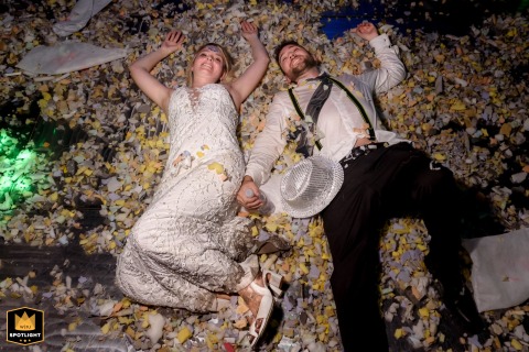 Exhausted Newlyweds Lie Contentedly On The Floor After Their Joyful Wedding Celebration In Santa Fe After the festivities on a farm in Santa Fe, Argentina, the bride and groom lie contentedly on the floor, savoring the last joyful time of their celebration.
