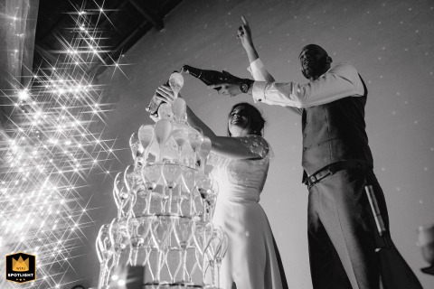 Festive Scene Setter Featuring Champagne Spray And Twinkling Lights At Chateau De Montrouge Loire Champagne spray, twinkling lights, and all-out excitement erupt in a burst of celebration for Laeticia and Guillaume at Château de Montrouge, Loire.