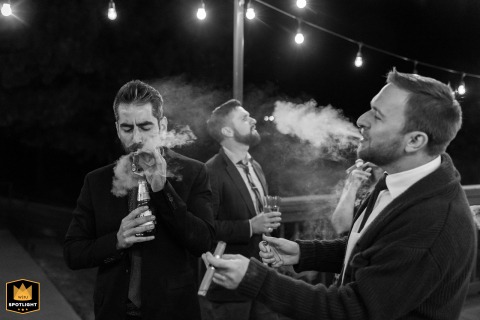 Wedding Guests Enjoy Cigars Under The Night Sky At Applewood Golf Course In Golden Colorado Wedding guests enjoy cigars under the night sky on the patio at Applewood Golf Course in Golden, Colorado, celebrating in a relaxed and convivial setting.