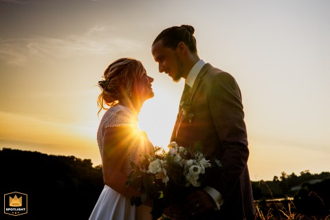 A couple enjoys golden hour at Domaine Massoulac in Tarn-et-Garonne, basking in beautiful light and sharing an intimate session as newlyweds in the gentle evening glow.