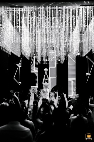 Action Scene Setter Of A Festive Wedding Bouquet Toss In Jales Sao Paulo Brazil A bouquet toss adds a touch of fun to the celebration in Jales, São Paulo, its flowers complementing the elegance of the wedding day.