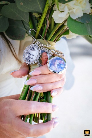 South Lake Tahoe, CA, the bride holds her loved ones close to her heart, attached to her bouquet, making her entrance filled with emotion and love.