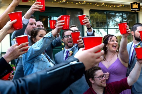 Playful Scene Setter Of Red Plastic Toasting Cups At A Wedding Gathering In Camarillo California Red plastic toasting cups bring a playful, festive touch to a joyful wedding gathering in Camarillo, CA, as guests come together to celebrate in an informal and lively atmosphere.