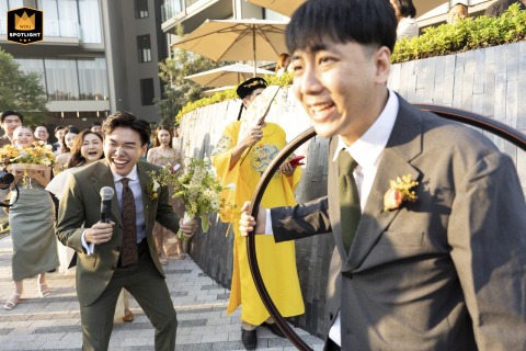 Playful energy fills Neera Retreat Hotel in Thailand during a lively wedding game, inviting laughter and friendly competition among guests and the wedding party.